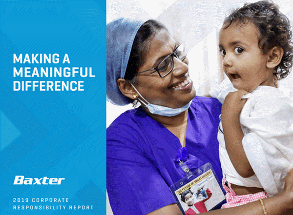 Image of a healthcare provider holding a young child in a hospital gown